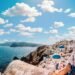 White Concrete House Near Body of Water Under White and Blue Cloudy Sky