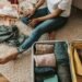 A Woman Packing Her Suitcase